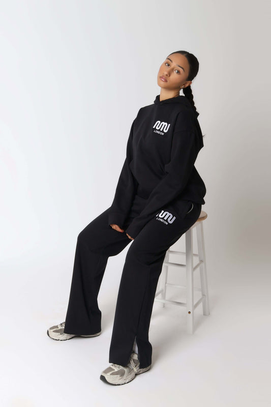 HEAVEN Relaxed Fit Hoodie - Premium Heavyweight Loungewear HEAVEN Hoodie front view HEAVEN Hoodie back view HEAVEN Wide Leg Joggers - Heavyweight Loungewear HEAVEN Joggers front view HEAVEN Wide Leg Joggers lifestyle shot Pulse Sports Bra with white logo