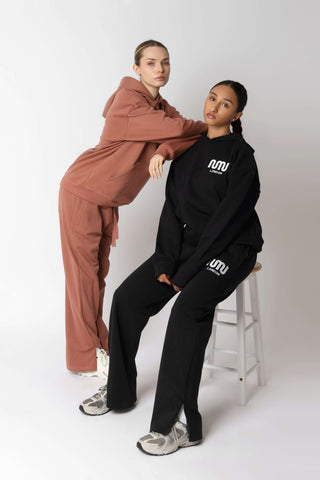 HEAVEN Relaxed Fit Hoodie - Premium Heavyweight Loungewear HEAVEN Hoodie front view HEAVEN Hoodie back view HEAVEN Wide Leg Joggers - Heavyweight Loungewear HEAVEN Joggers front view HEAVEN Wide Leg Joggers lifestyle shot Pulse Sports Bra with white logo